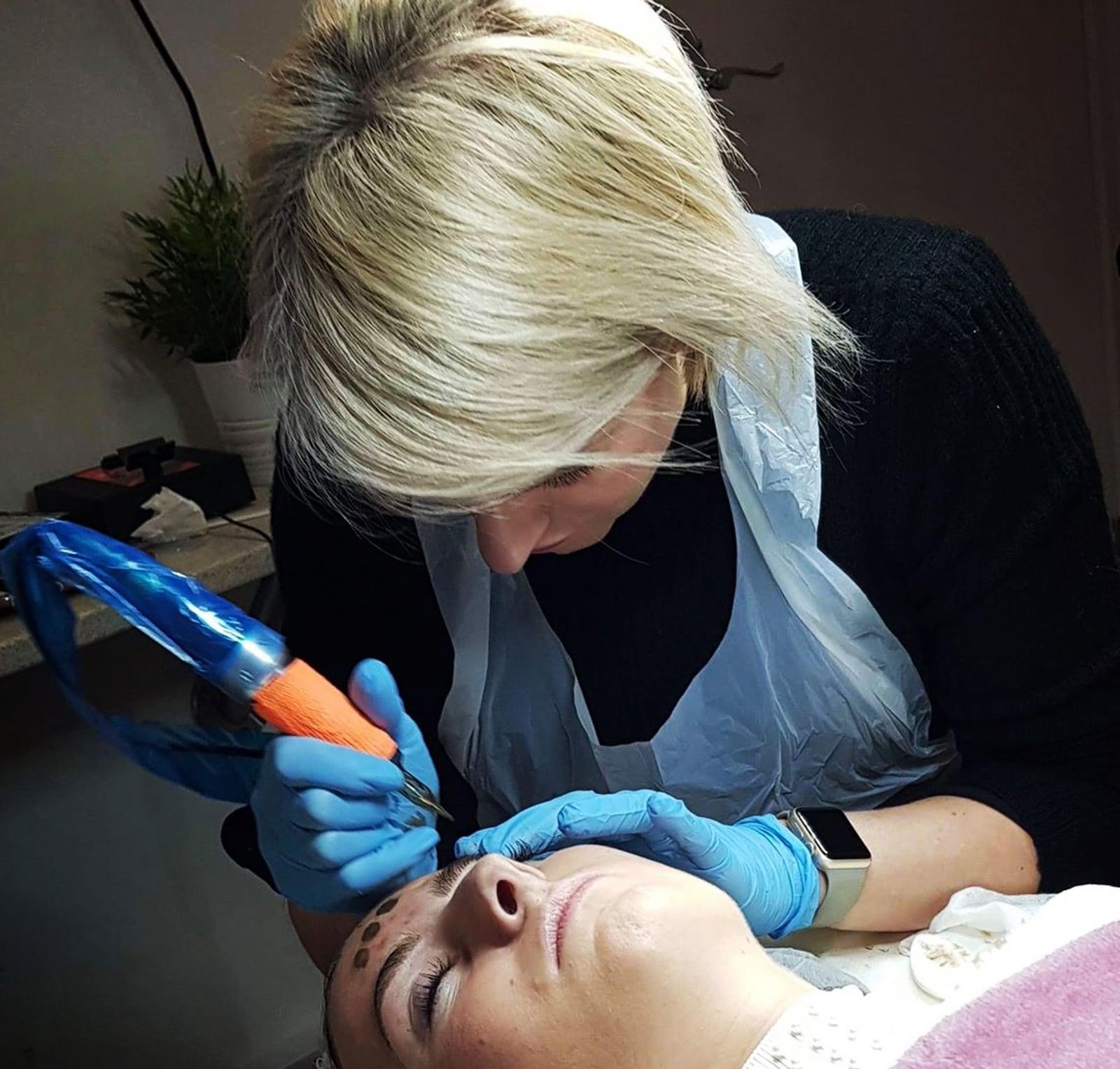 Nicola tattooing a client’s brows