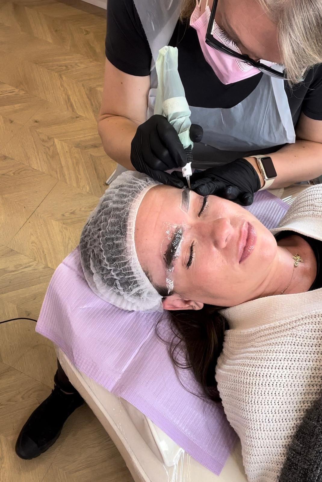 Nicola tattooing a client’s brows